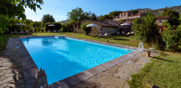 The photo shows the swimming pool in the garden of
										Monastero San Silvestro Farmhouse