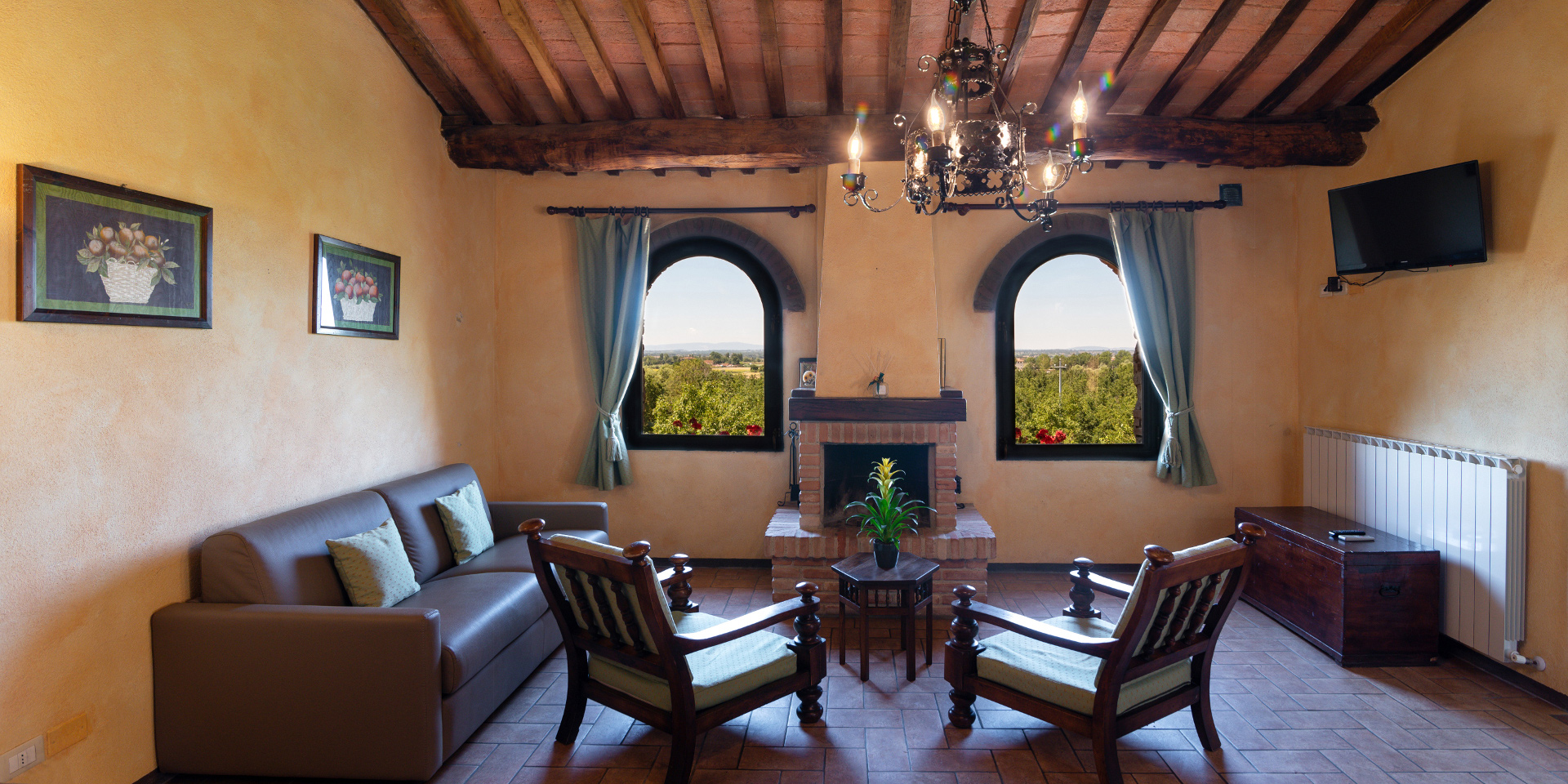 Living room with a chimney, Monastero San Silvestro Farmhouse