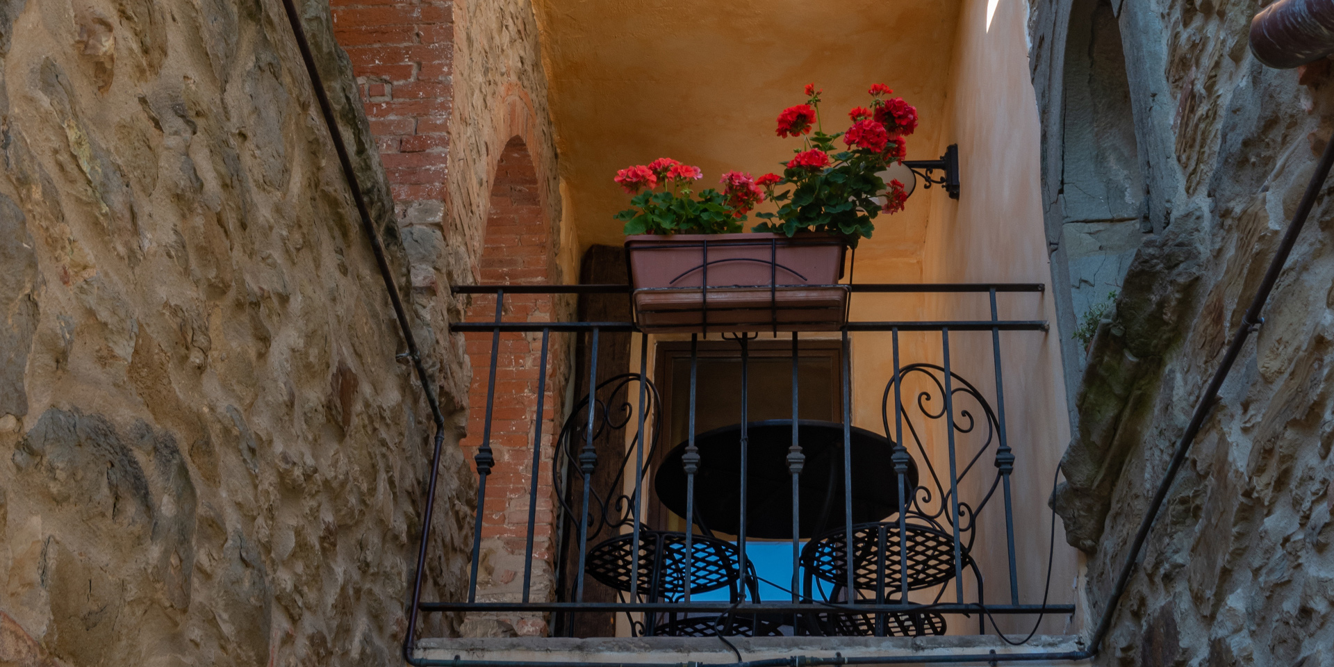 Coffee table with chairs on the terrace of Faesulae Apartment,
								Monastero San Silvestro