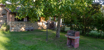 The photo shows a masonry barbecue in the garden of
										Monastero San Silvestro Farmhouse